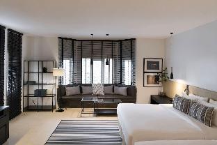 A cozy living with two king size beds