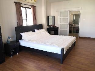 Clean and cozy bedroom with big bathroom.